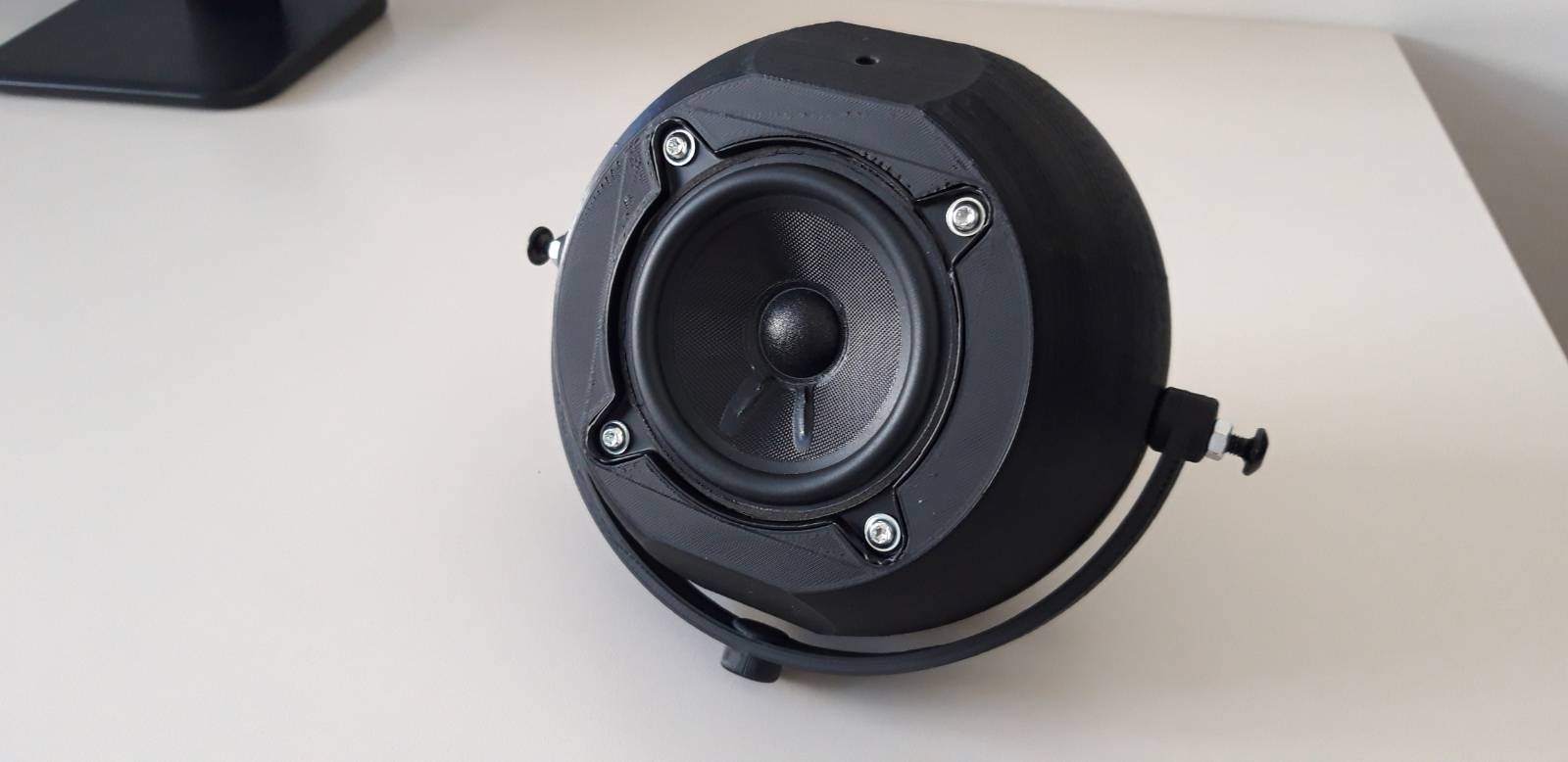 3D printed prototype of the spherical enclosure with a handle