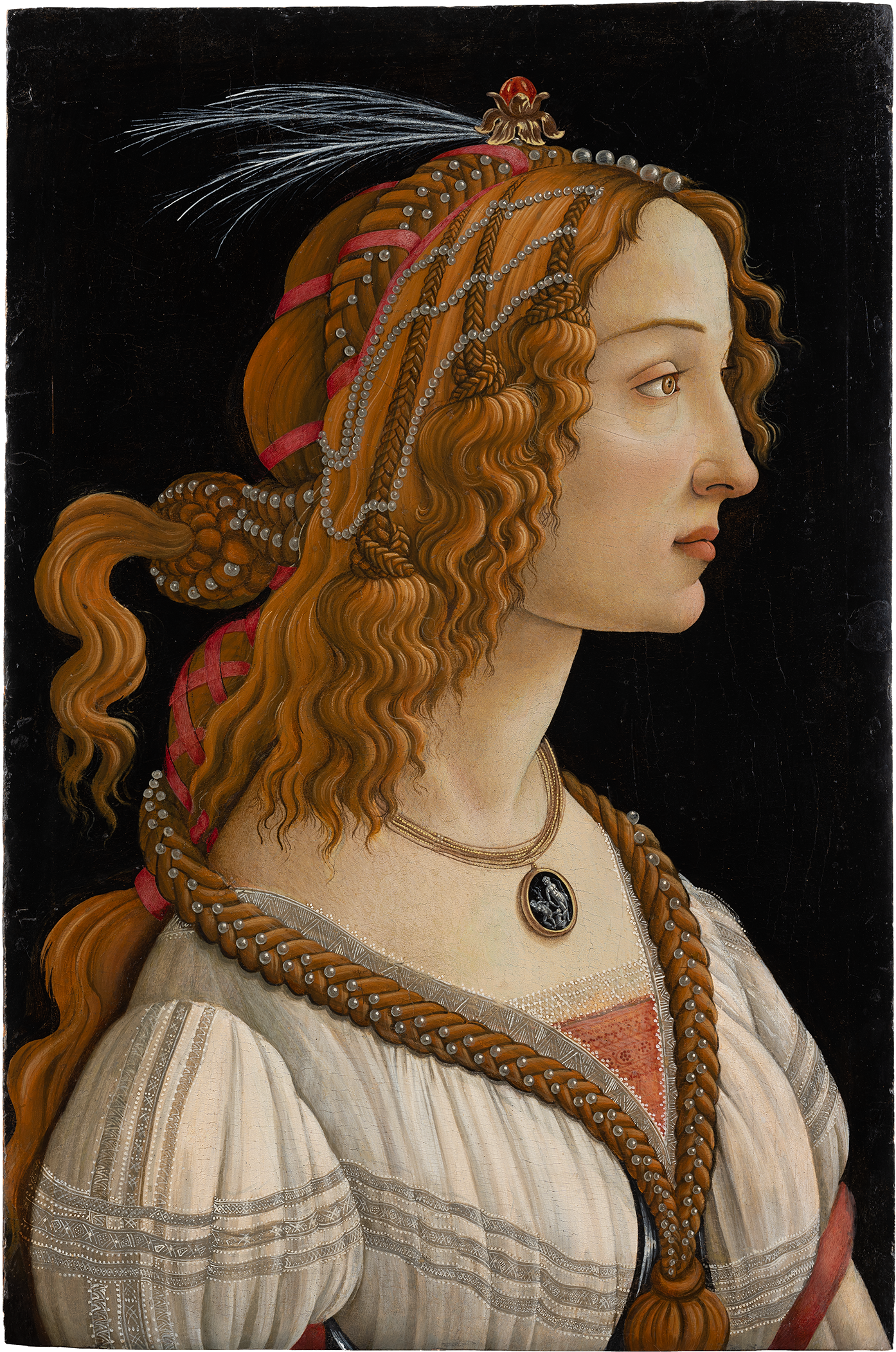 A Renaissance portrait of a young woman shown in profile against a dark background. She has long, wavy auburn hair intricately braided and adorned with pearls, ribbons, and a feathered ornament. She wears an elegant white gown with delicate embroidery and a necklace featuring a cameo pendant.