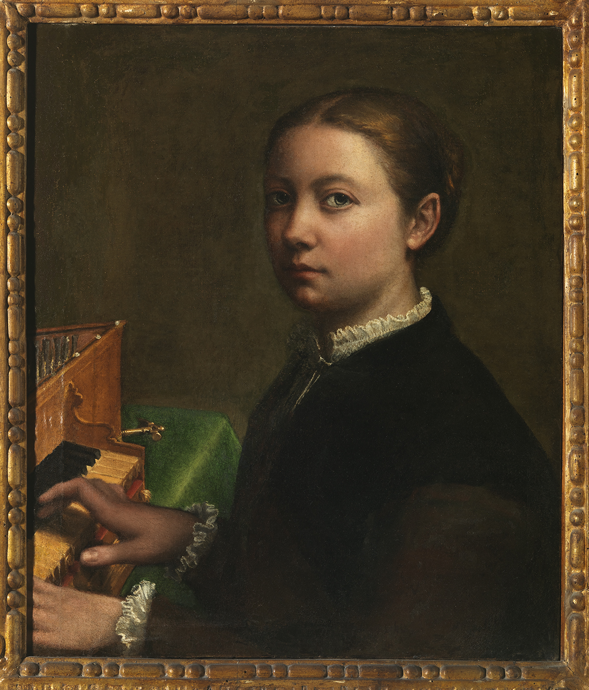 A Renaissance portrait titled “Autoritratto alla spinetta” (Self-Portrait at the Spinet), painted by Sofonisba Anguissola around 1554–1555. The artist portrays herself seated at a small keyboard instrument, gazing calmly toward the viewer. The painting is framed in an ornate gilded wooden frame, and the subject’s modest dress and composed expression reflect refinement and musical skill.