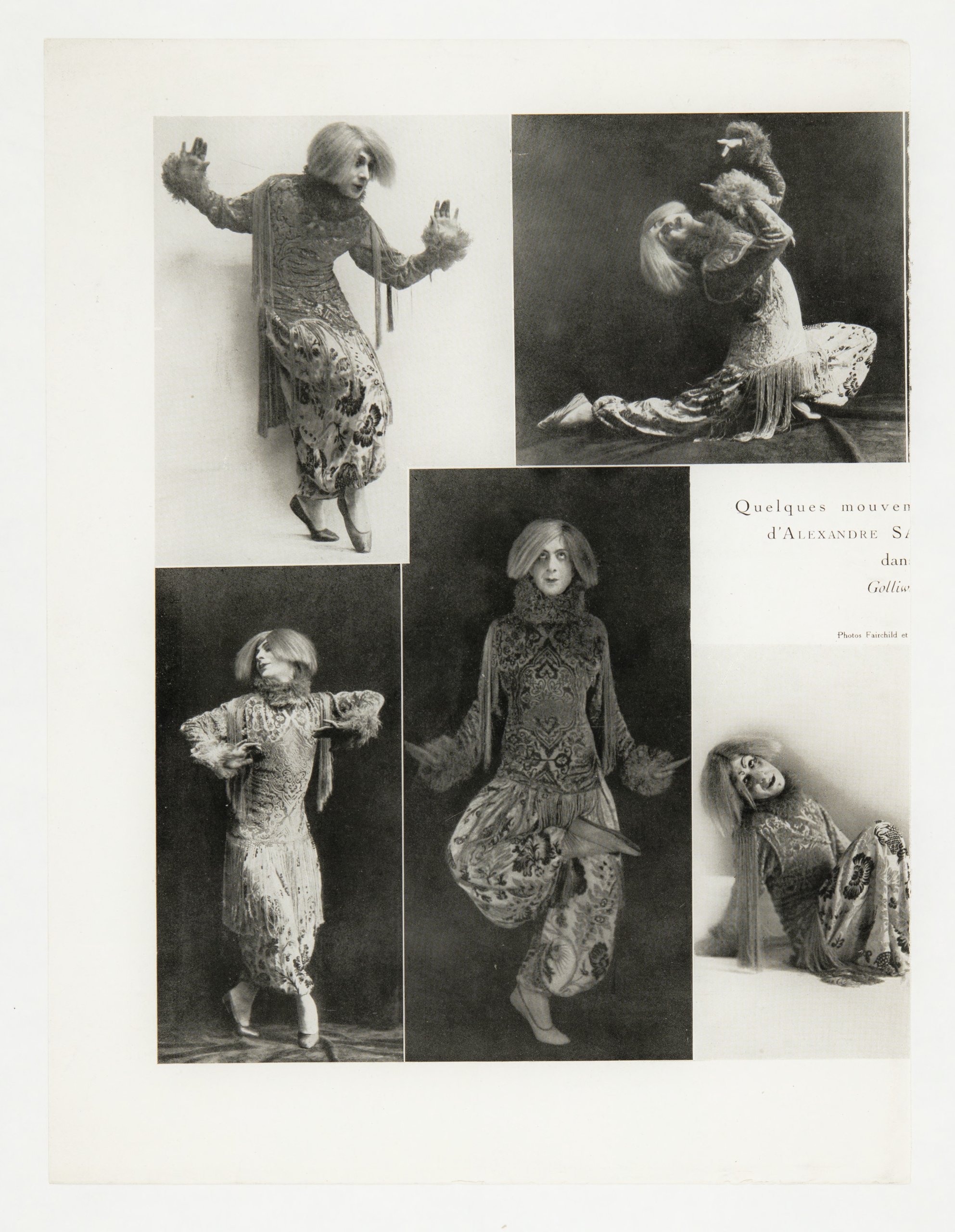A vintage photo collage containing five black and white images documenting the dynamic movements of the dancer Alexandre Sakharoff (also Sacharoff). The dancer wears the same elaborate, patterned costume in all five frames: a fringed, brocade-style tunic, matching harem pants, a large fur collar, and a light-colored, short wig. The overall presentation is stylized and theatrical. The photos show different moments of a performance, including: leaping, kneeling, striking expressive poses with arms outstretched, and crouching while holding a small, dark, animal-like prop (possibly a monkey or doll) on the shoulder. Text in the center-right area identifies the subject and performance, reading: "Quelques mouvements d'Alexandre S[akharoff] dans Golliwog[g's Cake Walk]".